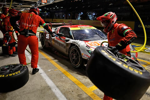 Pit crew works on the No. 55 Ferrari 296 LMGT3